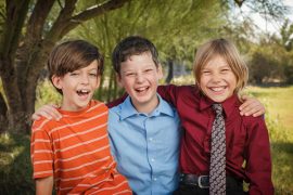 Three Fourth Graders Smiling