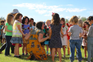 New Grade 1 students joinging their Grade 1 Teacher, Ms. Falcon